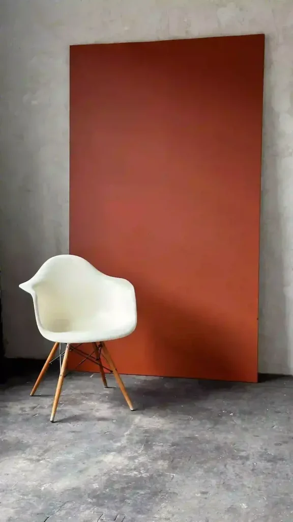 Minimalist photography setup at Lite Studio Northampton with red backdrop and white chair — ideal for portraits and brand shoots