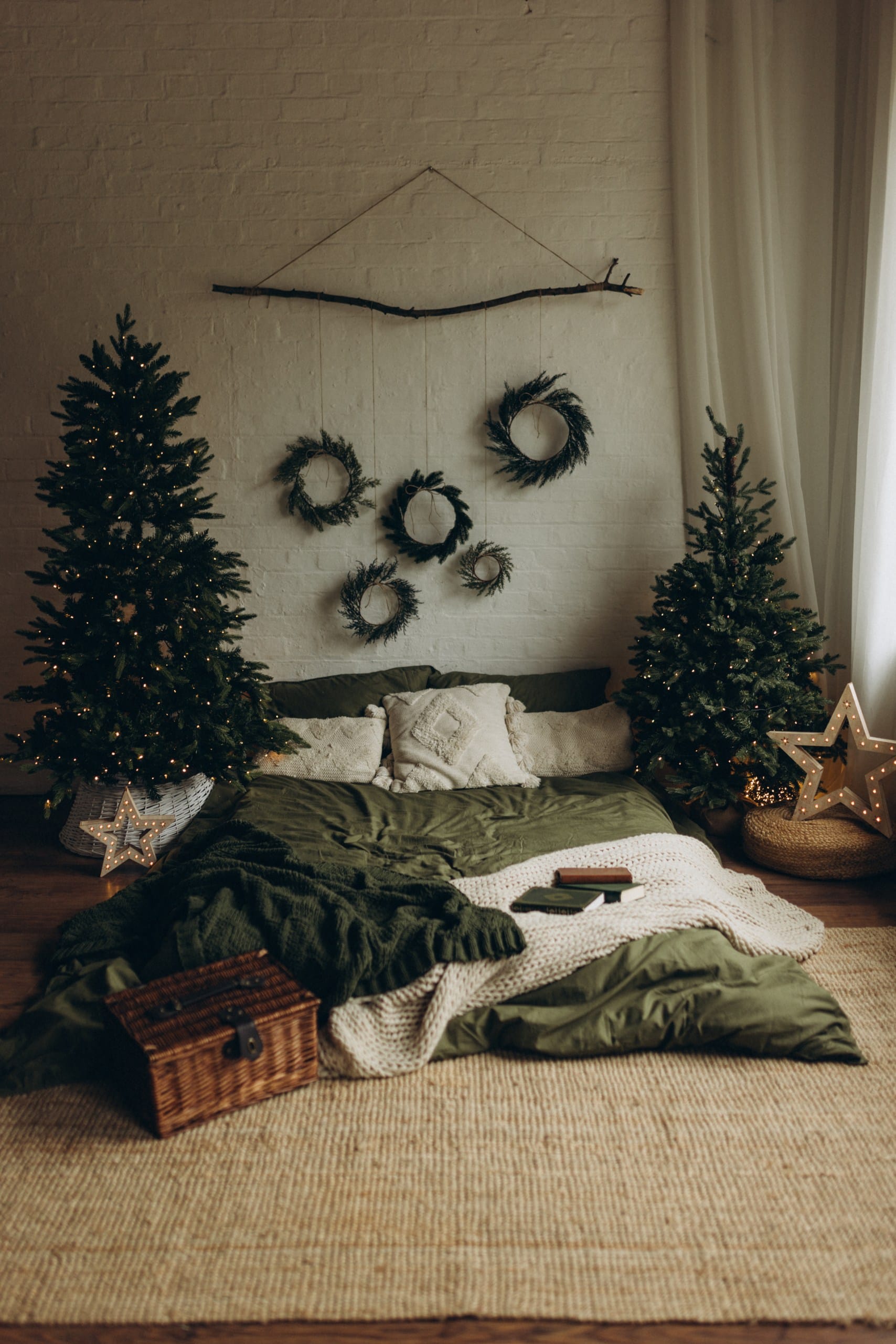 Close-up of wicker basket filled with Christmas decorations, wooden ornaments, pinecones and rustic details