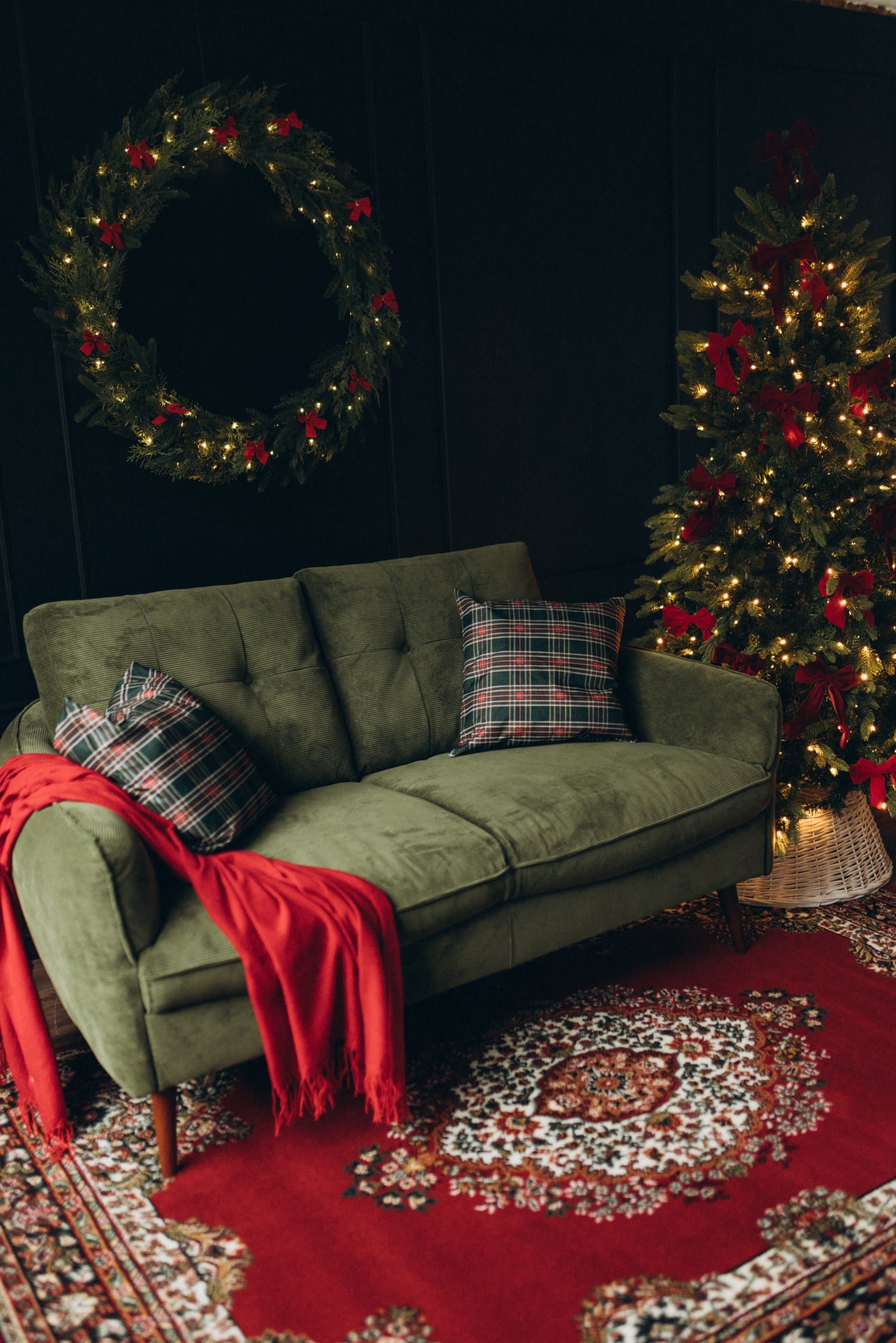 Close-up of wicker basket filled with Christmas decorations, wooden ornaments, pinecones and rustic details
