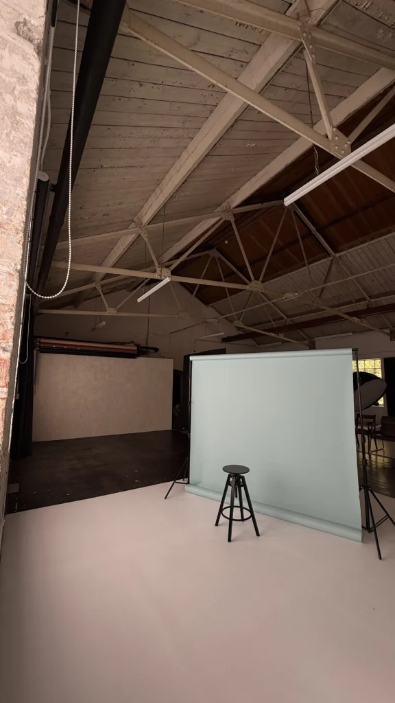 Blue paper backdrop set up in the main shooting space at Lite Studio