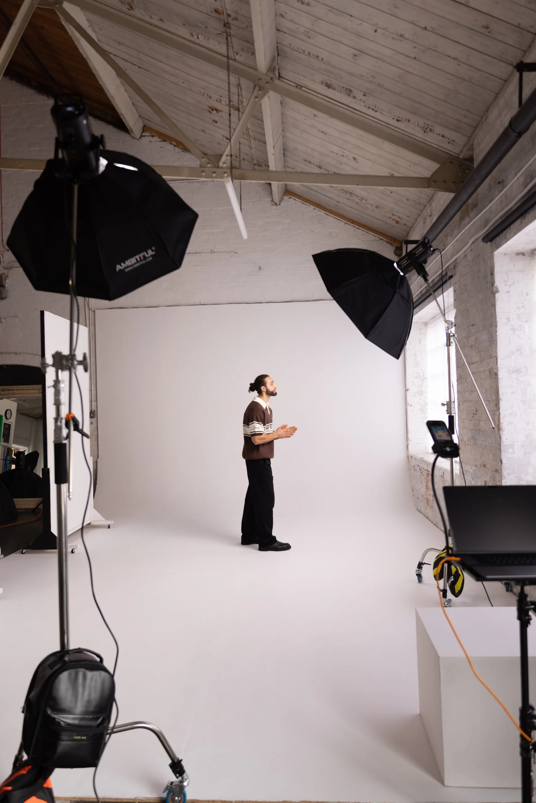 Styled interior setup with yellow backdrop in creative photo studio near London