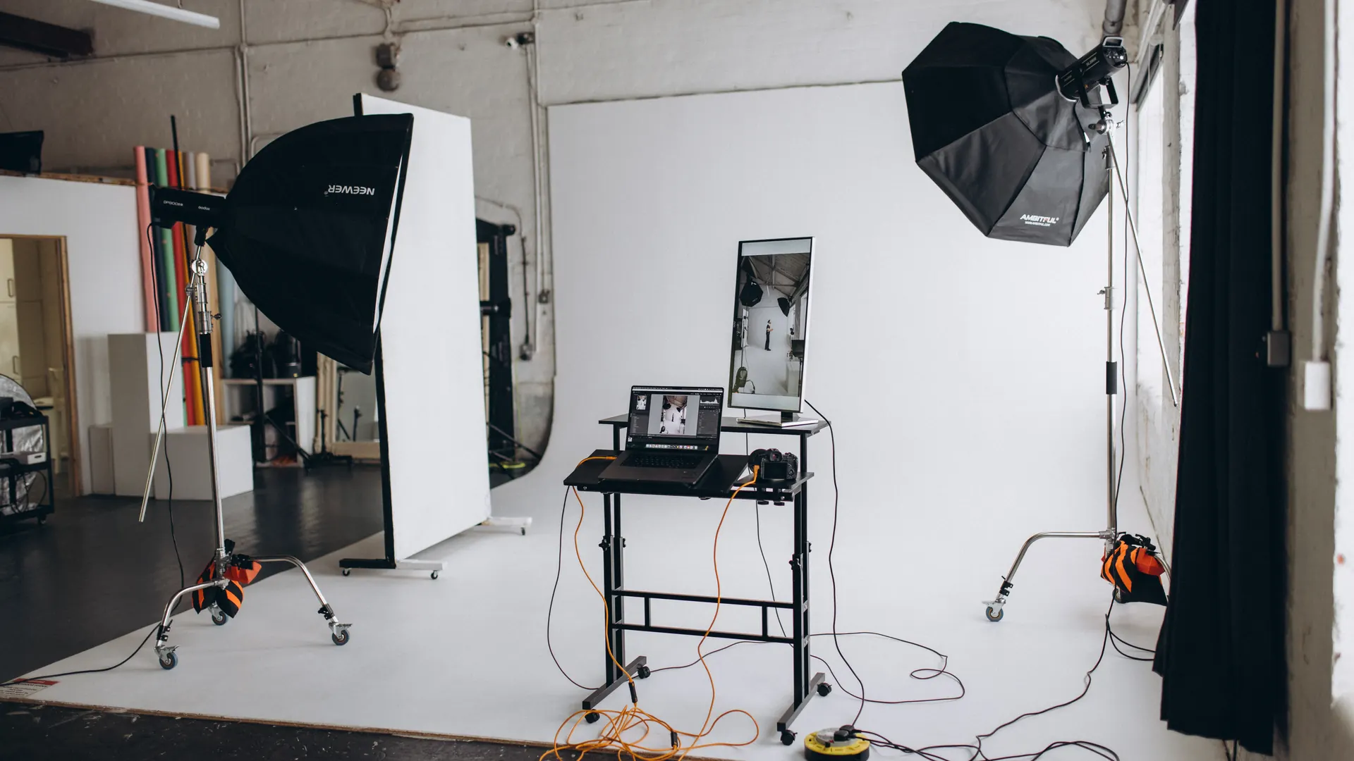 White cyclorama and professional lighting equipment at Lite Studio